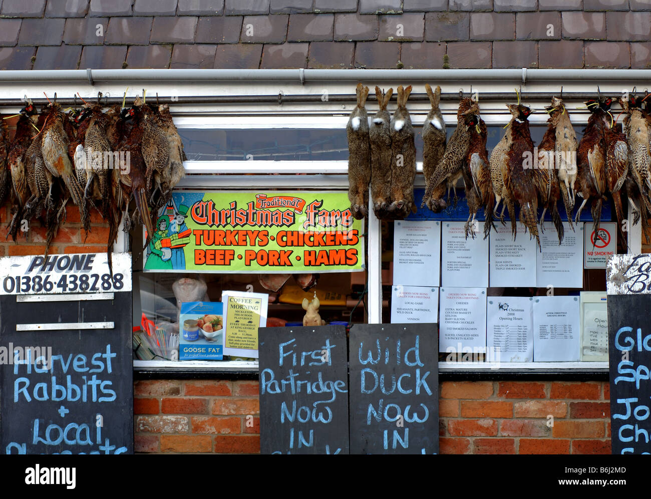 Traditional butcher`s shop at Christmas, UK Stock Photo